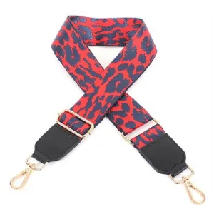 BURNT ORANGE AND NAVY LEOPARD GUITAR STRAP WITH BLACK LEATHER ENDS WITH GOLD CLASPS